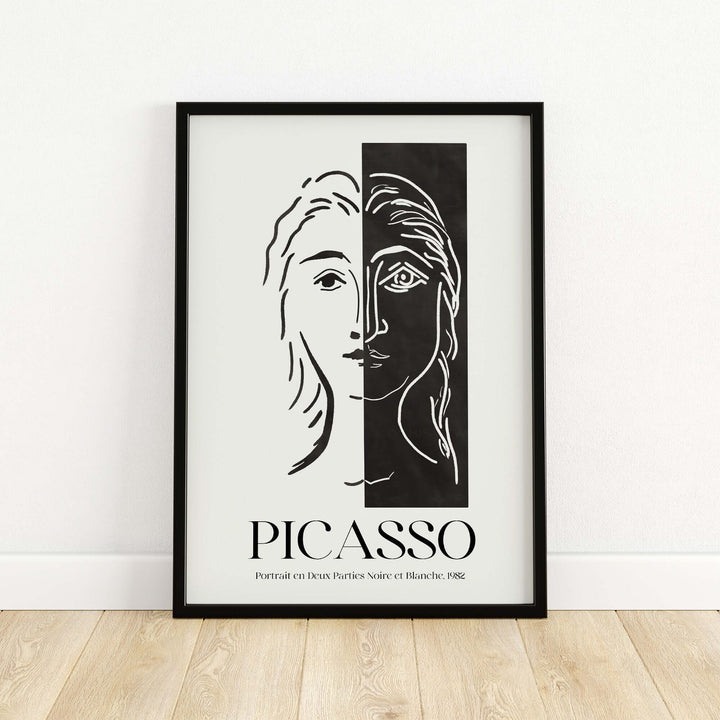 Black and white Picasso art print featuring a split face design, showcasing minimalist abstract style and modern duality.
