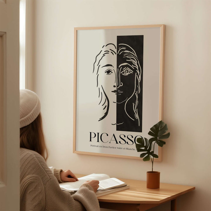 Picasso Portrait Deux Parties art print in black and white, showcasing a split face design on a wall.