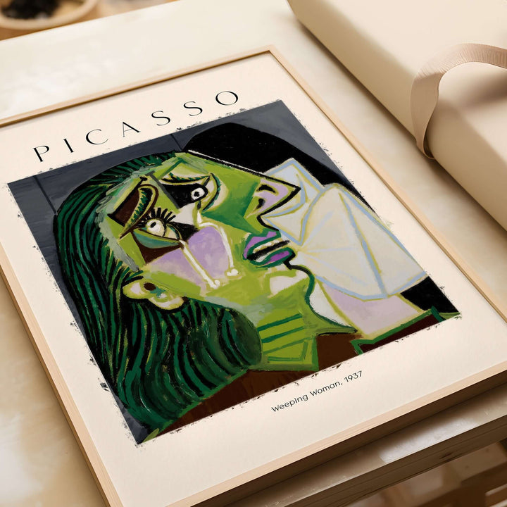 Picasso Weeping Woman 1937 art print featuring a distorted face and vivid colors, showcasing emotional expression in Cubism.