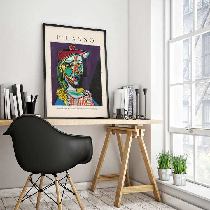 Picasso art print of Marie-Thérèse in beret, displayed in modern office with plants and wooden desk.