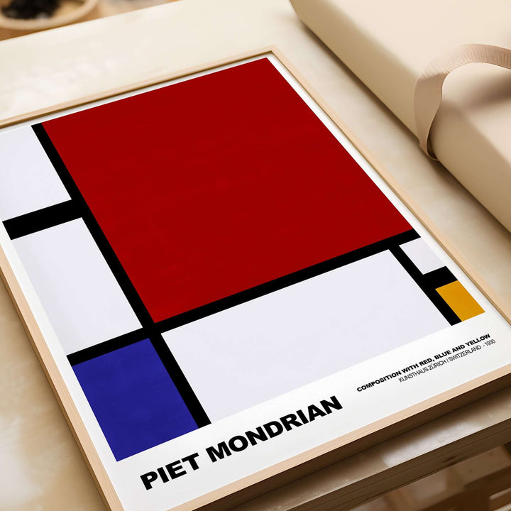 Piet Mondrian abstract art print featuring red, blue, yellow, and black geometric design, showcasing Composition with Red, Blue, Yellow (1930).