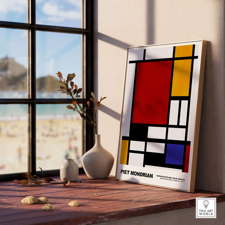 Piet Mondrian Composition Red Yellow Blue 1939 De Stijl poster displayed on a sunny windowsill with beach view.