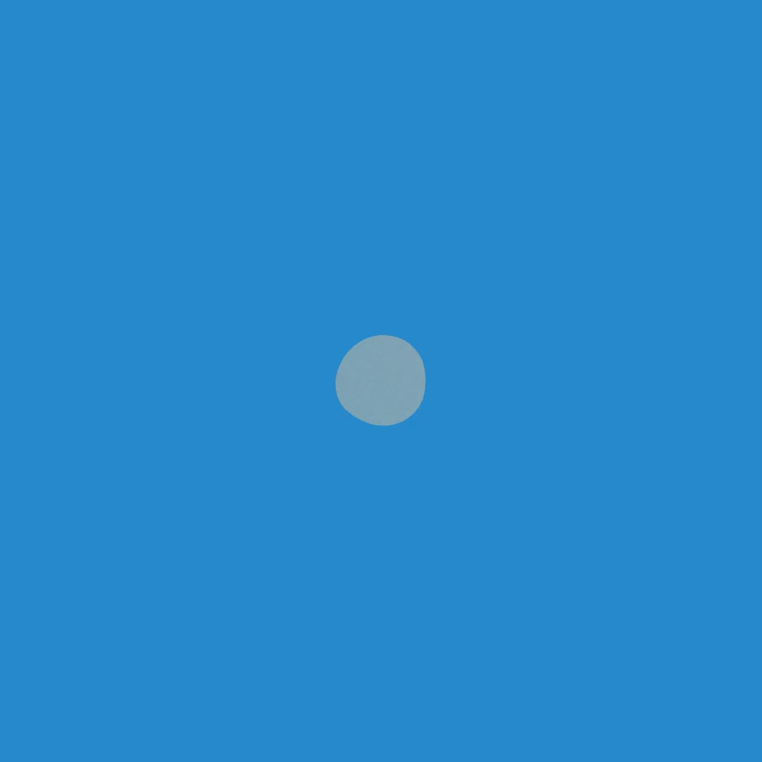 Minimalist blue background with a single light gray circle in the center, representing simplicity and tranquility.