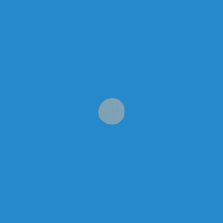 Minimalist blue background with a single light gray circle in the center, representing simplicity and tranquility.