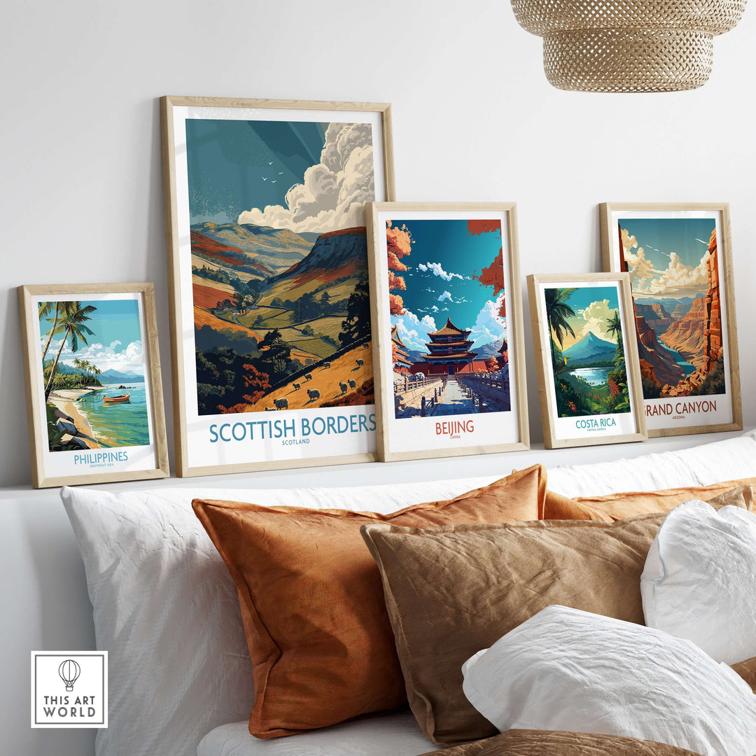 Framed travel posters featuring landscapes from Scottish Borders, Beijing, Costa Rica, and Grand Canyon on a sofa.