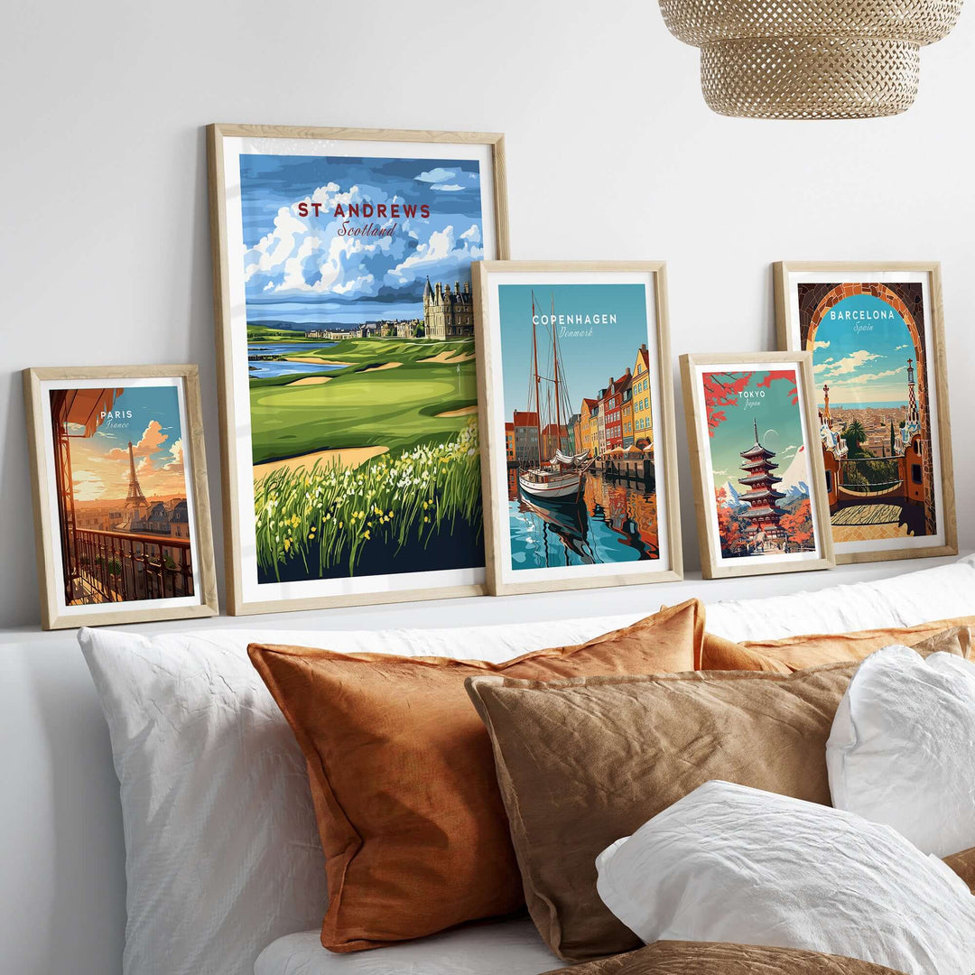 St Andrews Scotland Old Course sunset poster among framed travel prints on a stylish modern bed with decorative pillows.