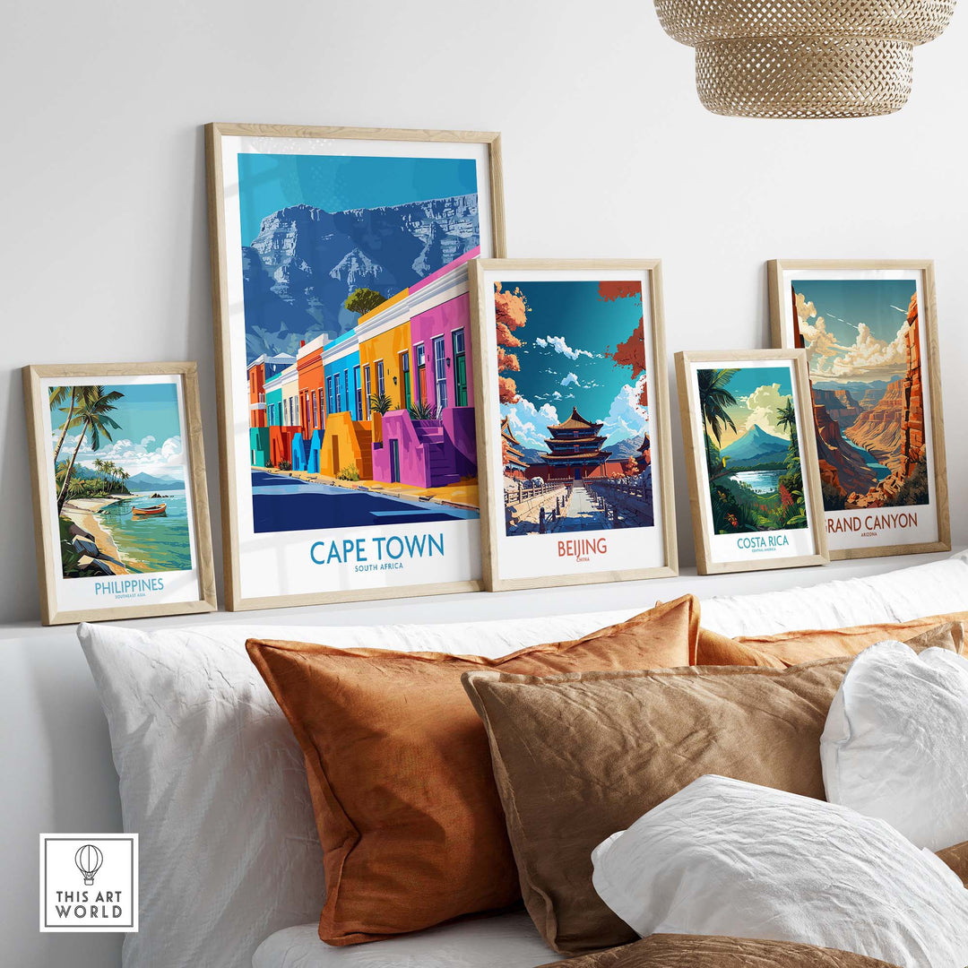 Colorful travel posters of Cape Town, Beijing, Costa Rica, and the Grand Canyon displayed in a stylish home setting.