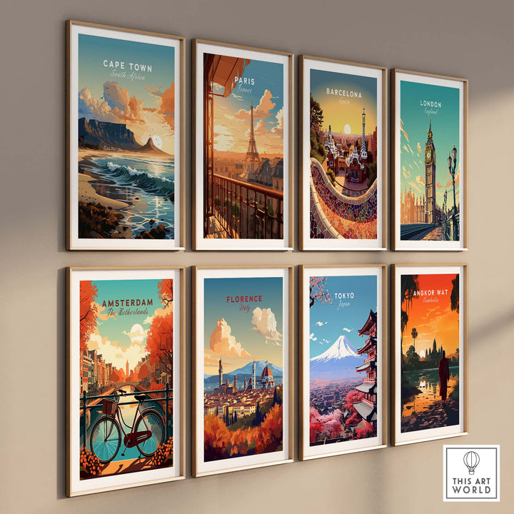 Framed travel posters of Cape Town, Paris, Barcelona, London, Amsterdam, Florence, Tokyo, and Angkor Wat on a wall.