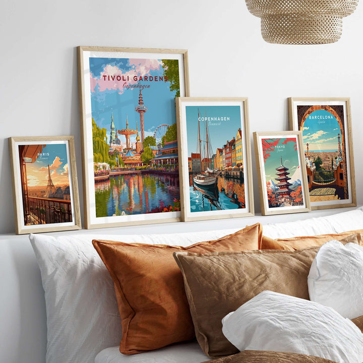 Framed Tivoli Gardens Copenhagen wall art prints on a cozy sofa, showcasing vibrant Scandinavian cityscapes.