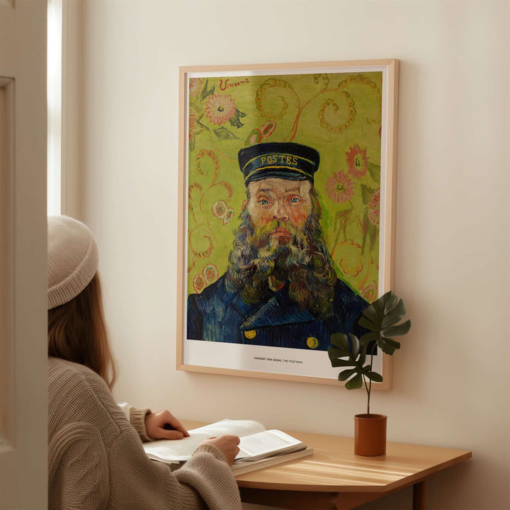 Vincent van Gogh's The Postman art print displayed on a wall, featuring bold colors and expressive details.