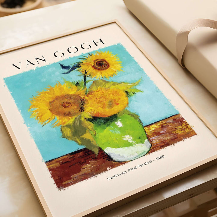 van Gogh Sunflowers print featuring vibrant yellow blooms in a green vase against a turquoise background.