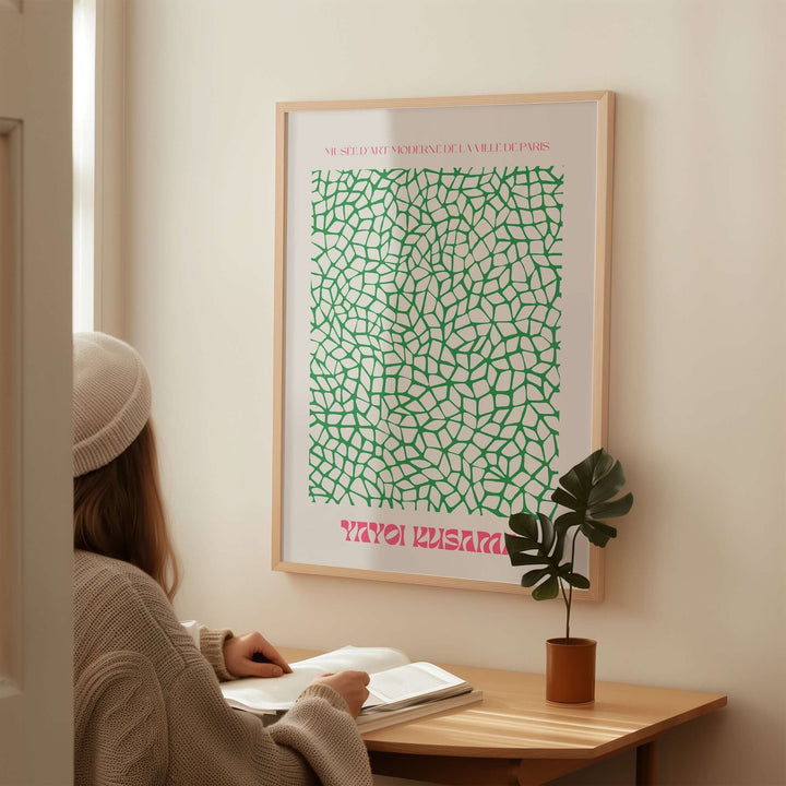 Yayoi Kusama green net pattern abstract art print featured in modern decor setting.