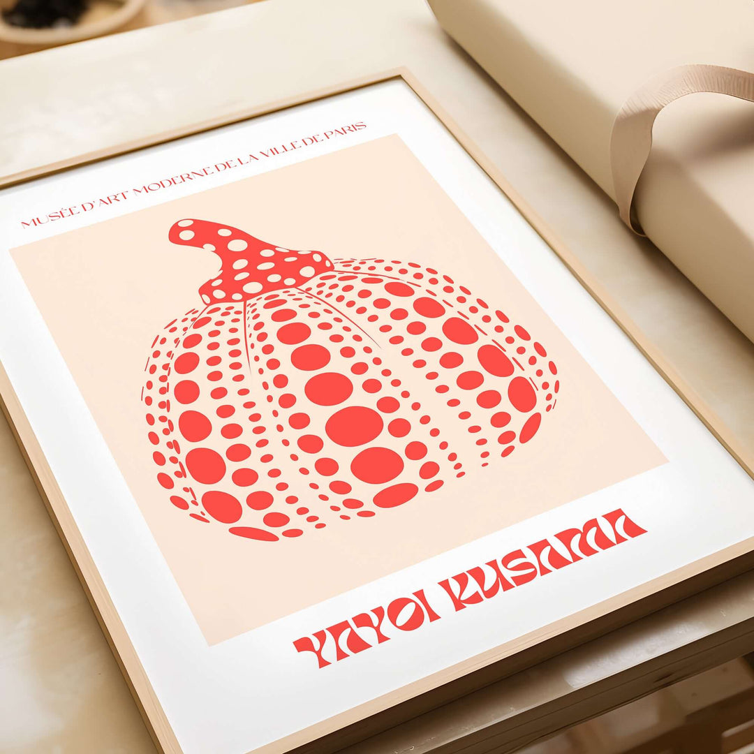 Yayoi Kusama's red pumpkin polka dot art print poster framed, featuring playful dots and exhibition details.