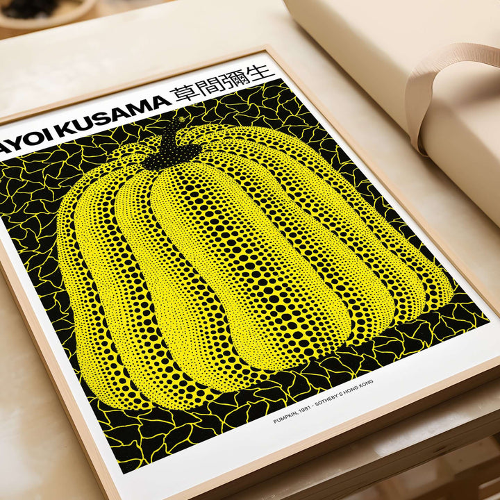 Yayoi Kusama yellow black pumpkin art print poster featuring polka dots on a black background.