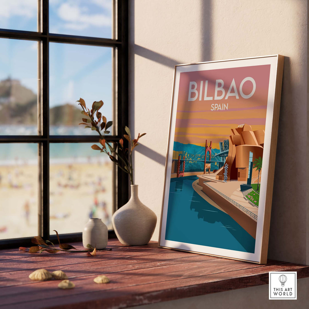 Art print of Bilbao, Spain displayed on a table with a beach view, framed in minimalist style.