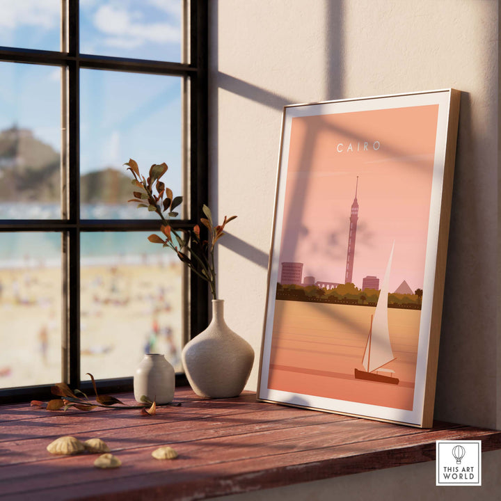 Cairo Print Wall Art Poster with vintage design, displayed beside a vase, showcasing a sailboat and iconic Cairo skyline.
