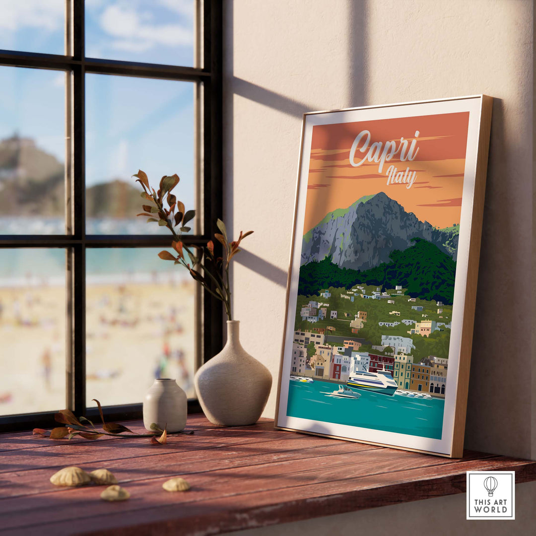 Capri Italy poster print wall art displayed in a cozy room with a view of the beach and mountains.