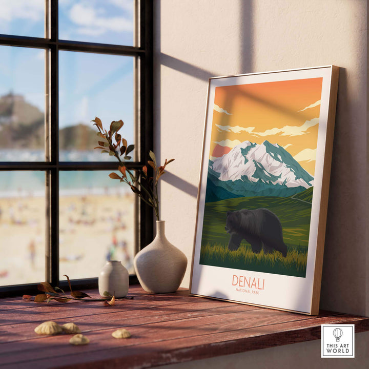 Framed Denali National Park poster featuring a bear and mountains, showcasing minimalist art style in a stylish interior.
