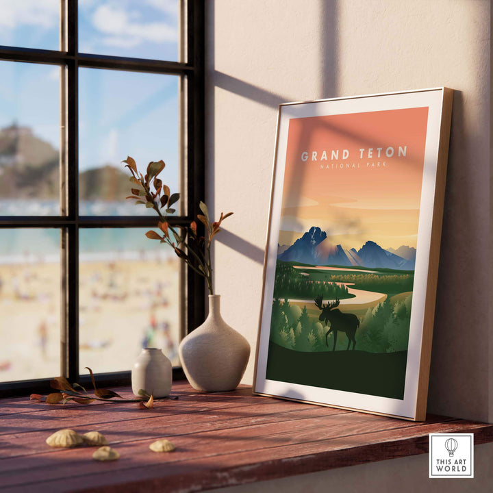 Framed Grand Teton National Park art print featuring mountains and a moose, displayed in a stylish interior setting.