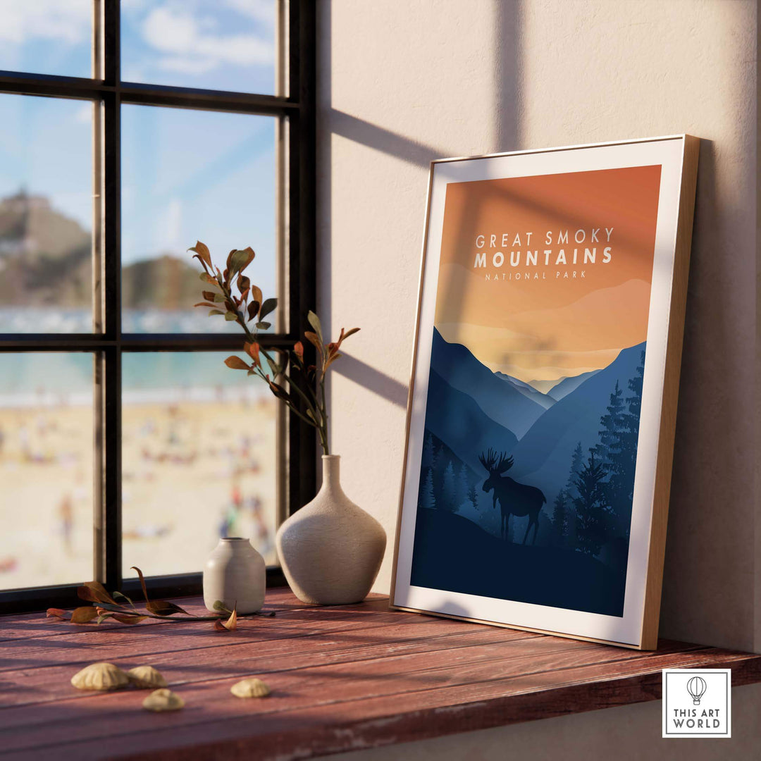 Framed Great Smoky Mountains art print featuring a moose, displayed by a sunny window with a beach view.