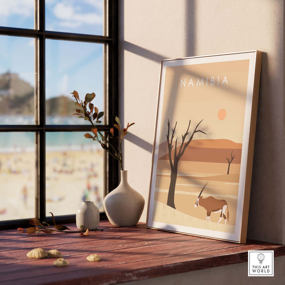 Namibia Print Dunes Poster displayed on a wooden table with a vase and window view, adding stylish decor to any space.