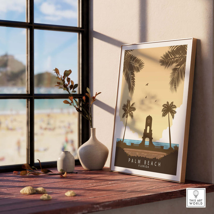 Palm Beach Florida print in a stylish frame on a wooden table, with a beach view and decorative elements.