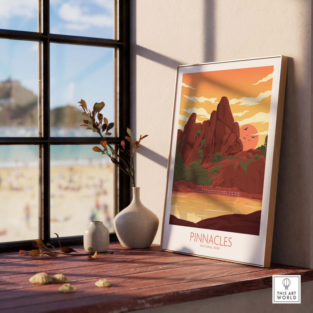 Pinnacles National Park poster in a stylish frame on a wooden table with a beach view and decorative vase.