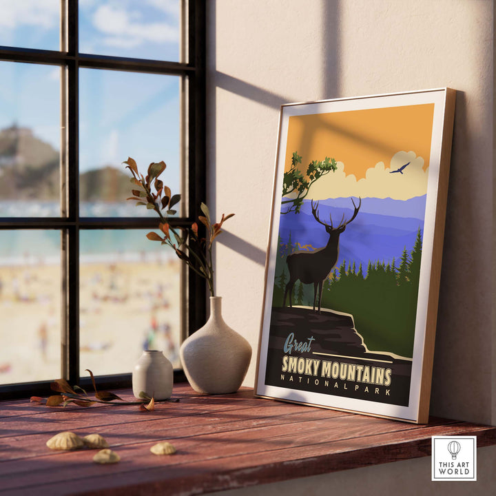 Smoky Mountains National Park poster framed by a sunlit window, featuring a deer and scenic landscape.
