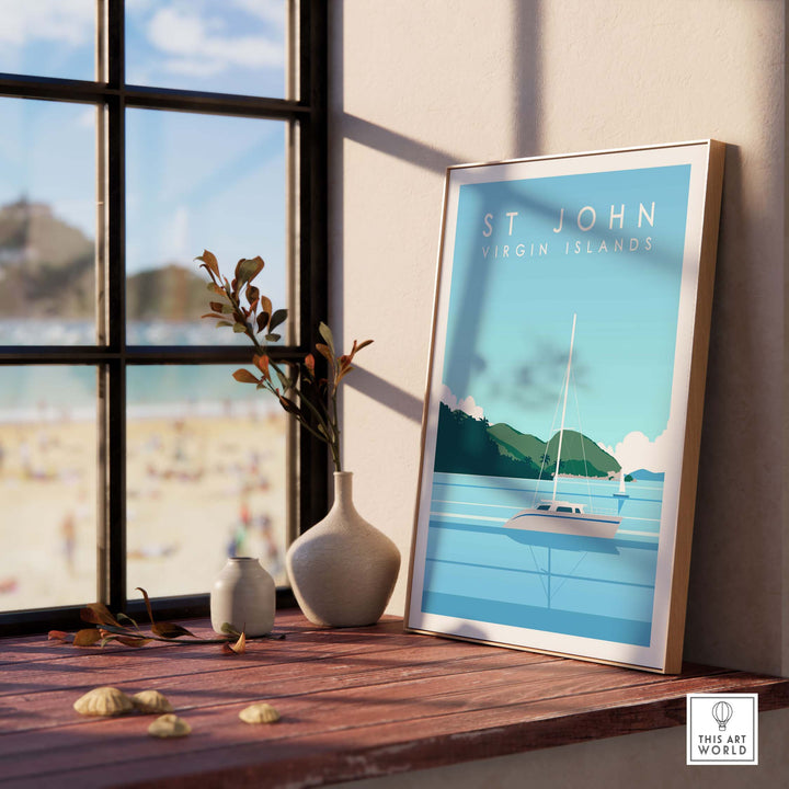 St John Virgin Islands travel poster framed in bright interior, showcasing a serene beach scene and a sailboat.