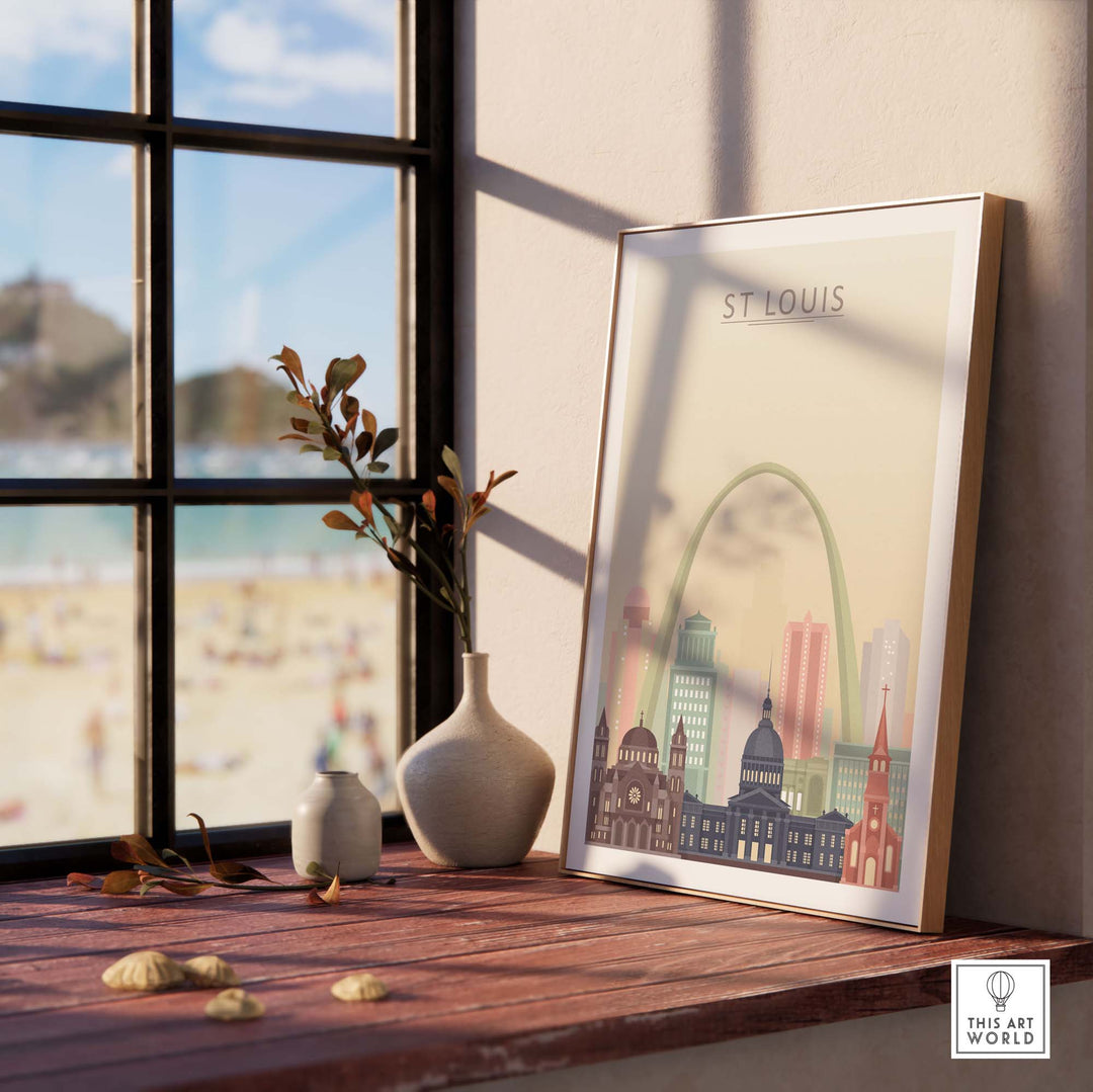 St Louis City Skyline Wall Art Print featuring iconic buildings in pastel colors, framed on a wooden table by a sunny window.