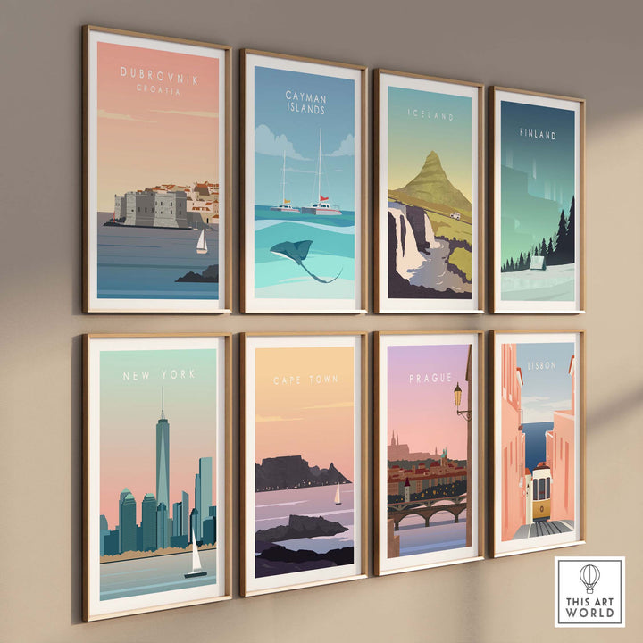 Collection of framed vintage travel posters featuring Dubrovnik, Catman Islands, Iceland, Finland, New York, Cape Town, Prague, and Lisbon.