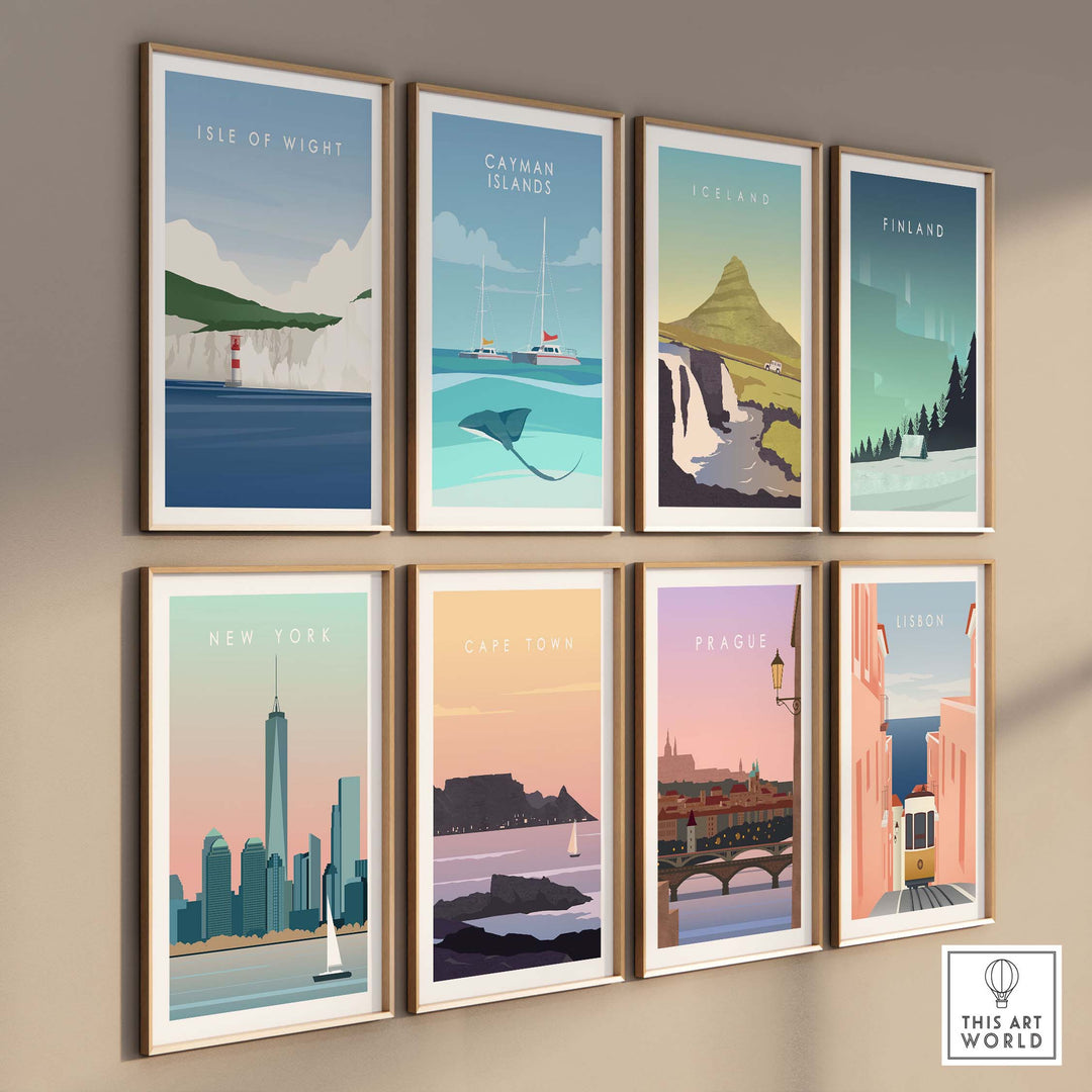 Collection of framed vintage travel posters including Isle of Wight, New York, and Cape Town on a wall.