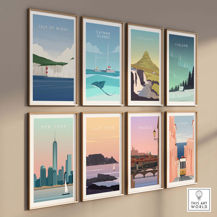 Collection of framed vintage travel posters including Isle of Wight, New York, and Cape Town on a wall.