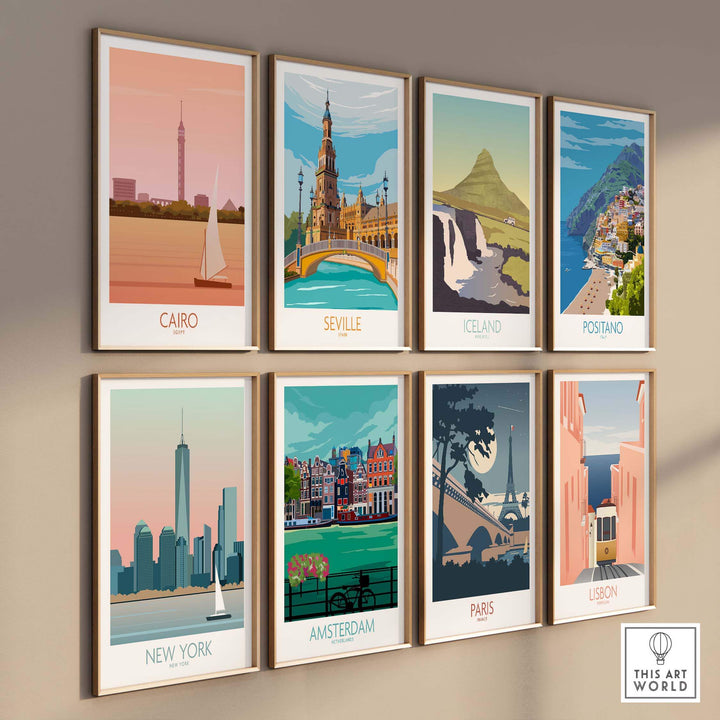 Stylish gallery wall of vintage travel poster prints featuring Cairo, Seville, Iceland, Positano, New York, Amsterdam, Paris, and Lisbon.