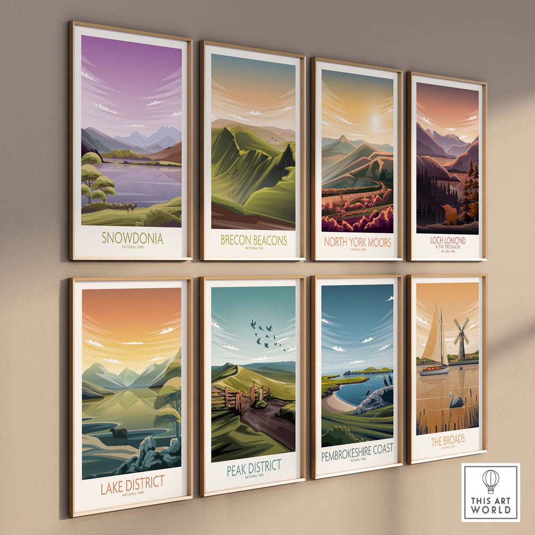 Collection of framed National Park art prints including Snowdonia and Lake District on a wall.