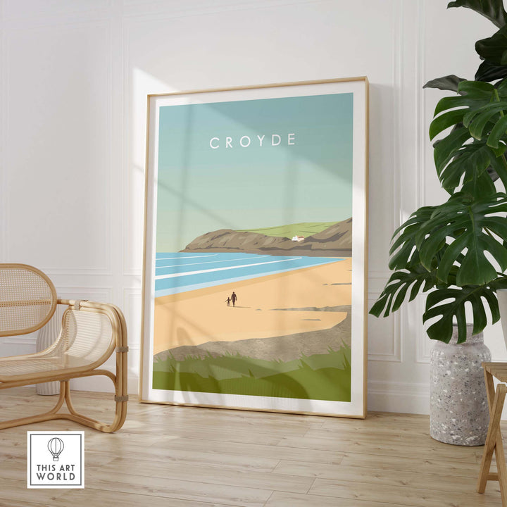 Croyde Poster Print Wall Art featuring a beach scene, framed and displayed in a stylish interior setting.