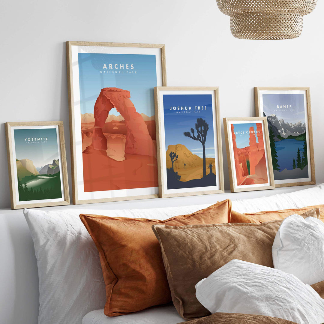 Framed vintage-inspired travel posters of national parks like Arches and Yosemite on a stylish wall.