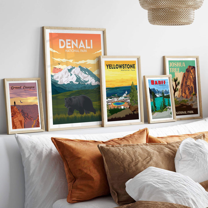 Framed Denali and National Park posters displayed on a wall, showcasing nature-inspired artwork in a cozy home setting.