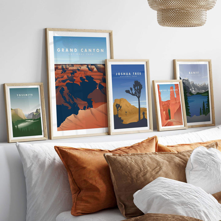Framed vintage travel art prints of Grand Canyon, Joshua Tree, and Yosemite displayed above cozy pillows.
