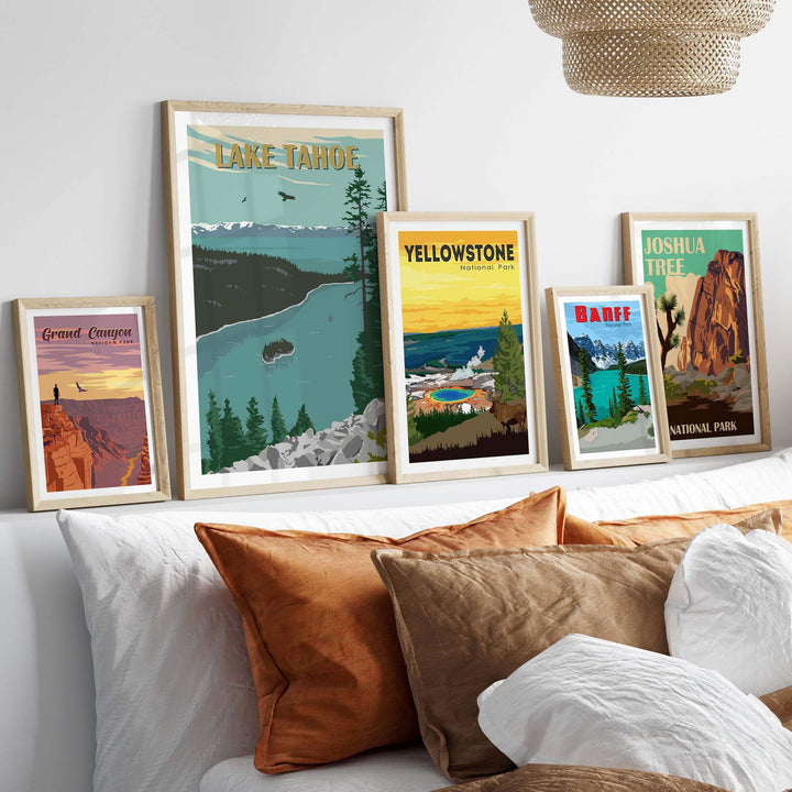 Framed vintage prints of Lake Tahoe, Yellowstone, and Joshua Tree showcasing national park designs in an elegant display.