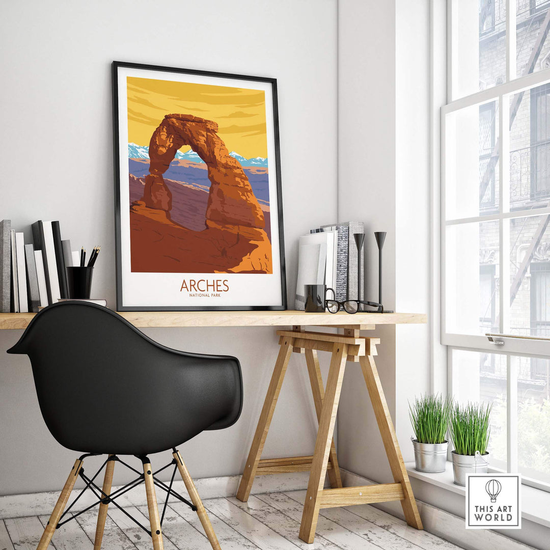 Arches National Park poster print displayed in a stylish home office setting with a modern chair and plants.