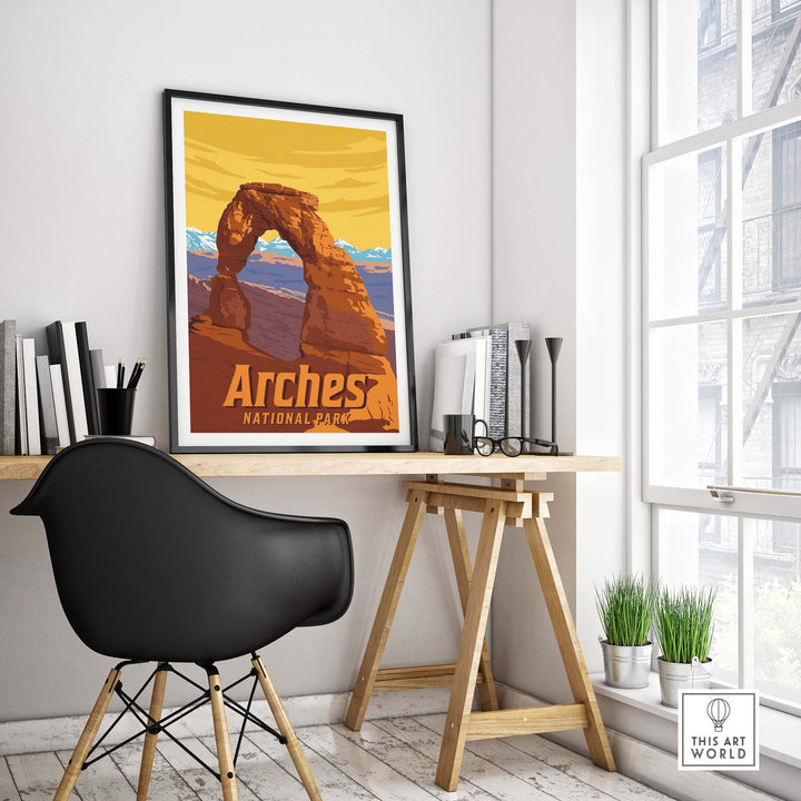 Framed Arches National Park vintage print in a stylish home office setup, showcasing beautiful outdoor scenery.