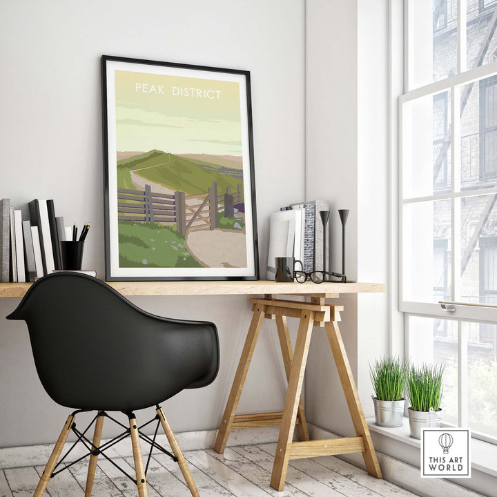 Stylish Peak District Print framed on wall, enhancing a modern workspace with vintage travel poster aesthetics.