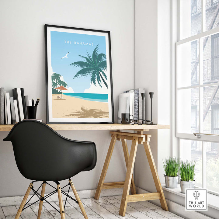 The Bahamas travel poster print featuring a beach scene with palm trees, framed in a modern home office.
