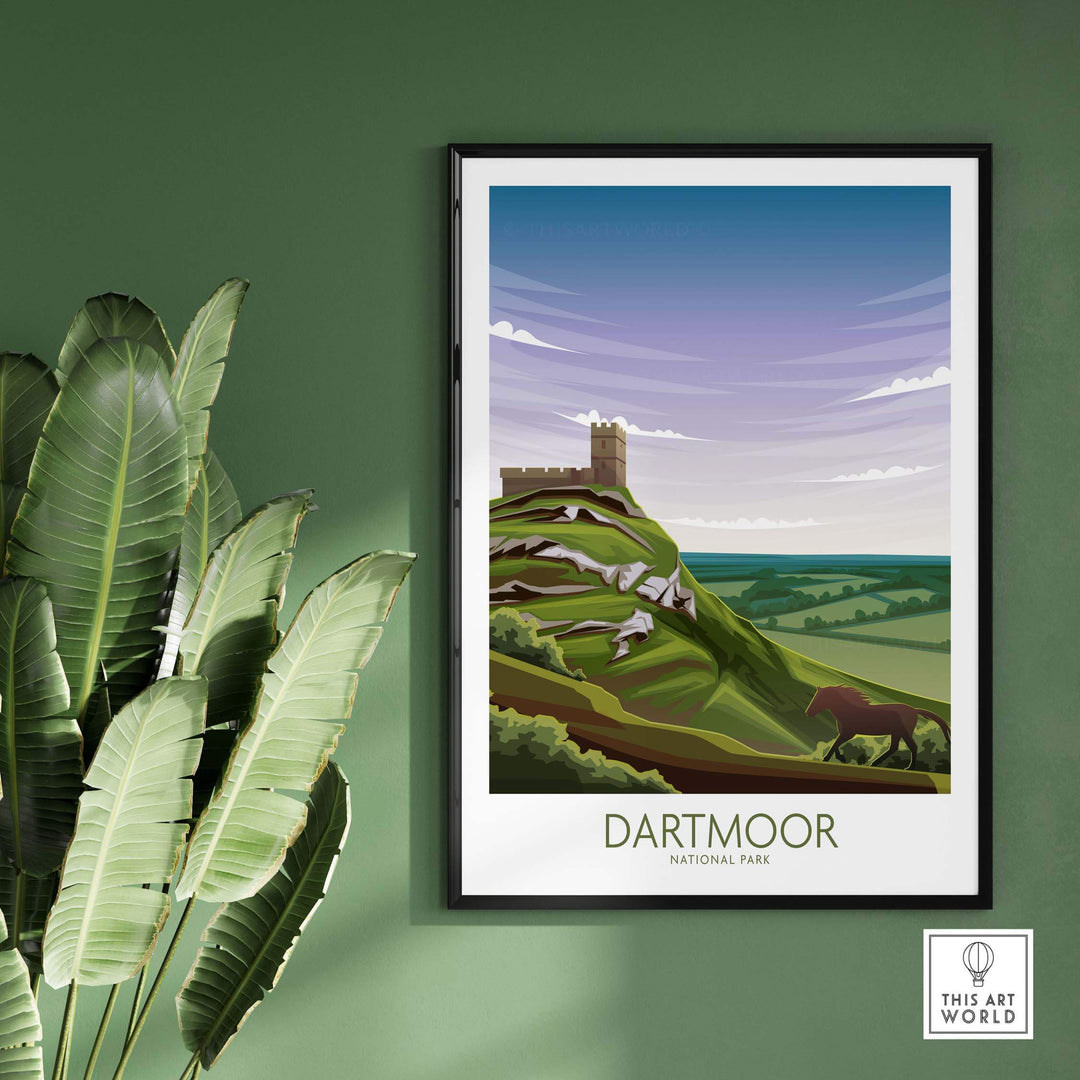 Dartmoor National Park poster art print featuring scenic landscape with hills and castle, framed on a green wall.