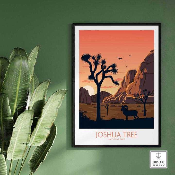 Joshua Tree National Park poster featuring desert landscape and silhouette of a ram, framed on a green wall.