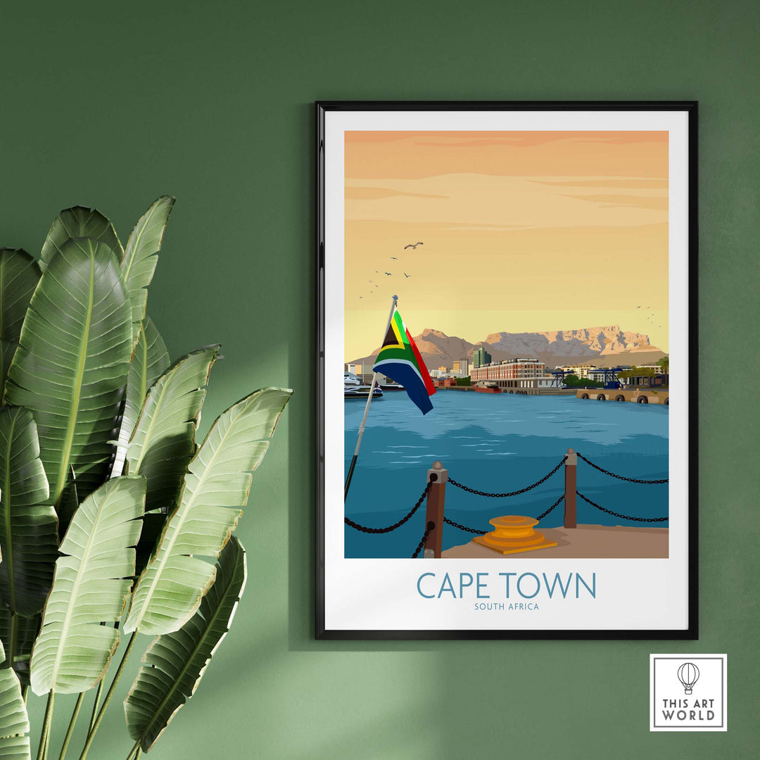 Cape Town print poster featuring a scenic view of Table Mountain and South African flag, framed against a green wall.