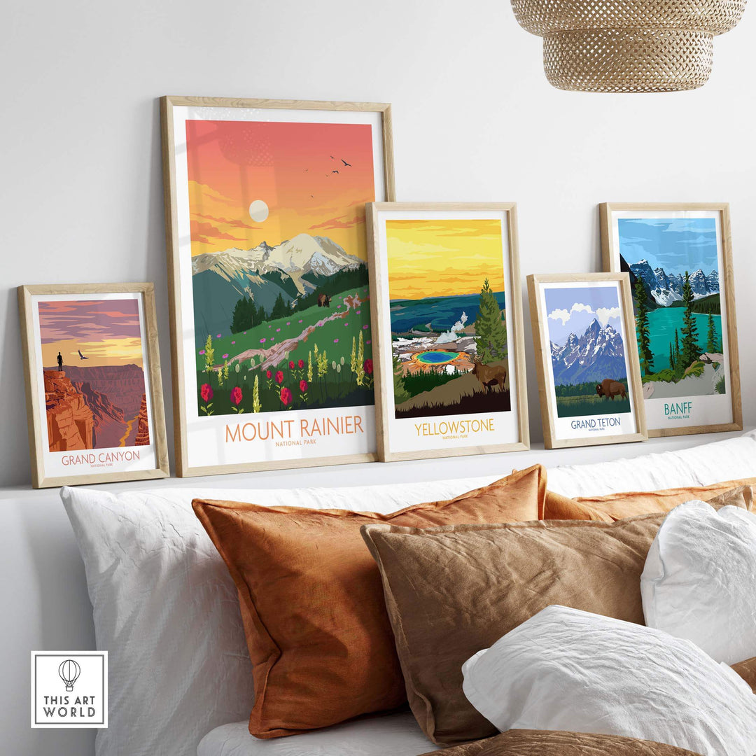Framed Mount Rainier, Yellowstone, Grand Canyon, Grand Teton, and Banff art prints displayed on a stylish couch.