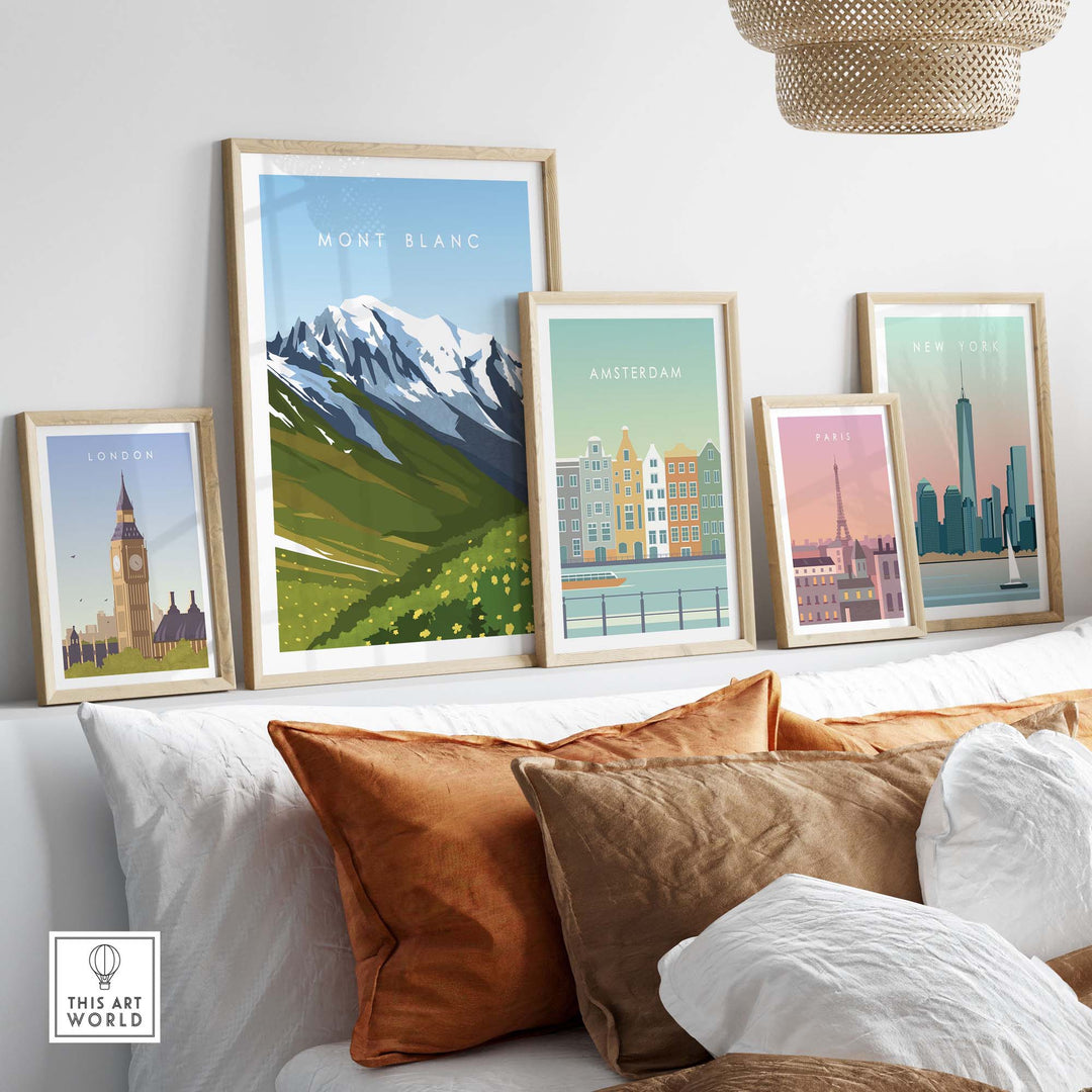 Framed Mont Blanc travel poster print displayed with other city artwork on a modern sofa.