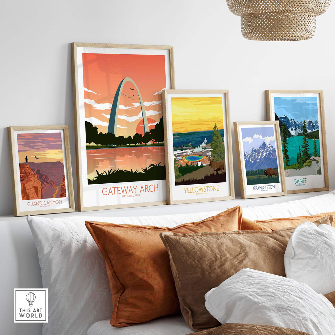 Framed posters of Gateway Arch, Yellowstone, Grand Canyon, Grand Teton, and Banff art prints on a stylish wall.